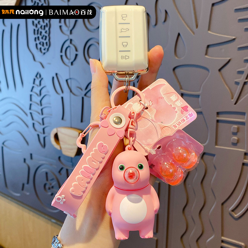 Genuine stress-relieving bubble-blowing pink milk dragon keychain, cute and creative female stress-relieving figurine key chain pendant Specification image