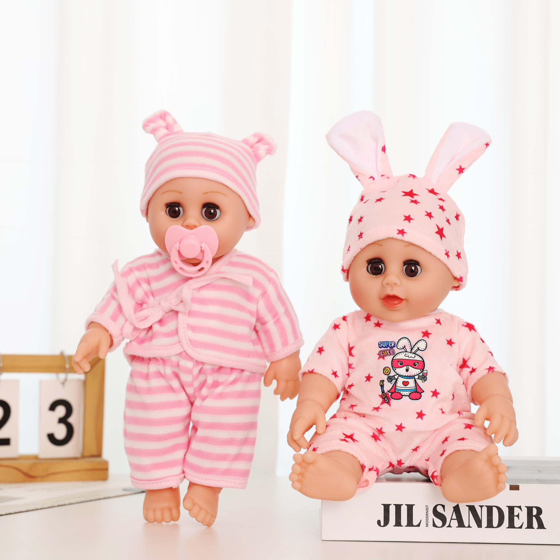 Wholesale of the new 12-inch eye-moving rebirth doll, a children's simulation soft rubber plush toy, and a role-playing toy Specification image