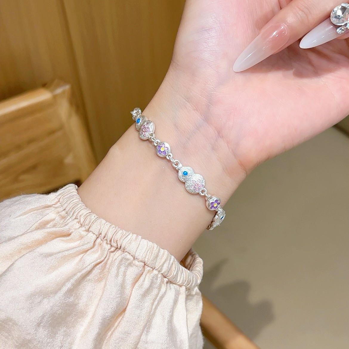 In 2025, a new style of traditional Chinese trend enamel gourd-shaped butterfly clasp hanging lucky bag bracelet with ethnic style and copper plated with Miao silver details Picture