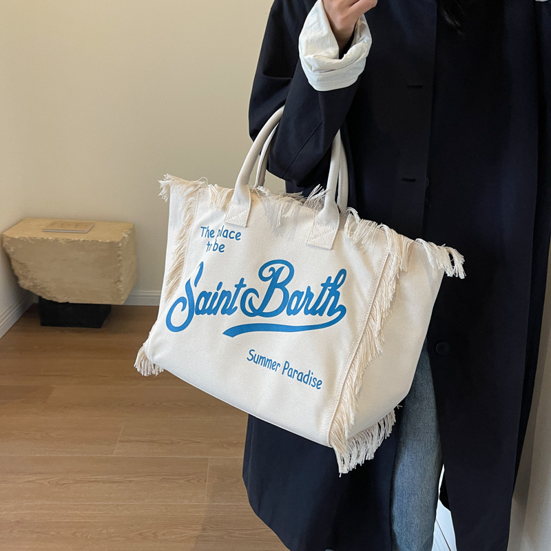 Cross-border canvas bag, printed letter canvas bag, large-capacity canvas tote bag, simple commuting lady single-shoulder bag, European and American beach bag, fringed canvas bag, tote bag, single-shoulder bag, canvas bag Specification image