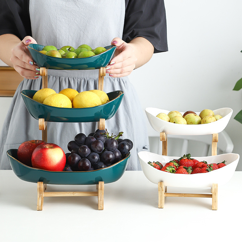 Multi-layer fruit and vegetable plate, bamboo and wood rack, ceramic creative double-layer snack and pastry plate, home living room dry storage Application Scenario