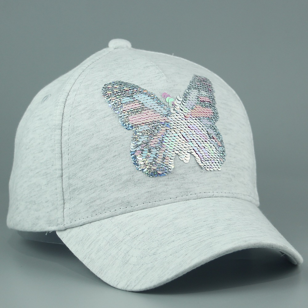 The children's caps from the cap factory are made of solid-color cotton with butterfly sequins, sunshade and cute baseball caps. They are printed and breathable for spring and summer