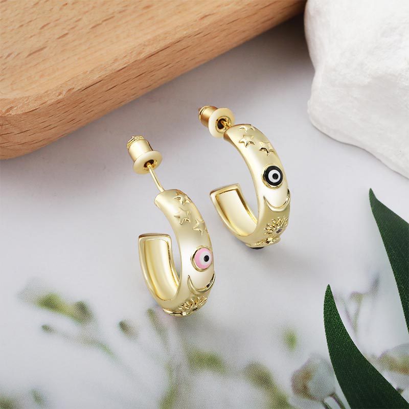 New copper-plated fashionable women's accessories with European and American style, C-shaped niche design stud oil drip Devil's Eye earrings Specification image