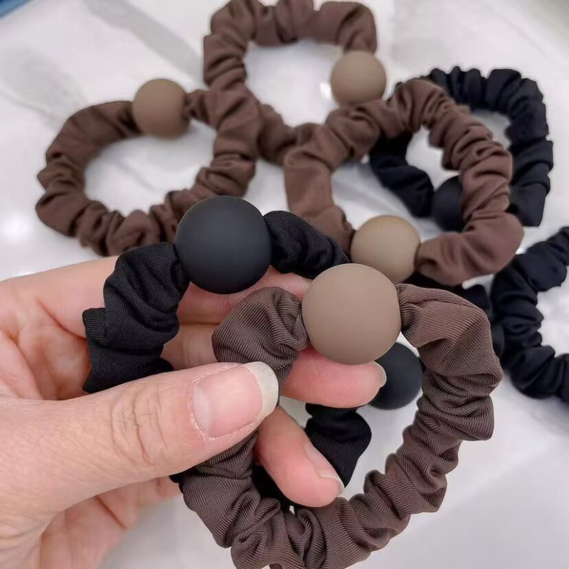 The matte round bead square simple hair band from Dongdaemun, South Korea, is a versatile and elegant hair accessory with a durable leather band
