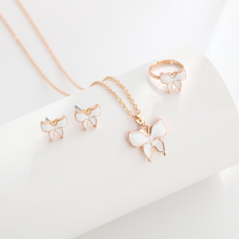 New cartoon bow necklace, ring, stud, three-piece set, children's alloy oil drip jewelry set wholesale Application Scenario