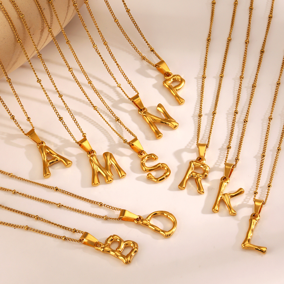 This is a trendy stainless steel 26-letter necklace with an InS-style niche design that is versatile. It features a bamboo joint letter collarbone chain Application Scenario