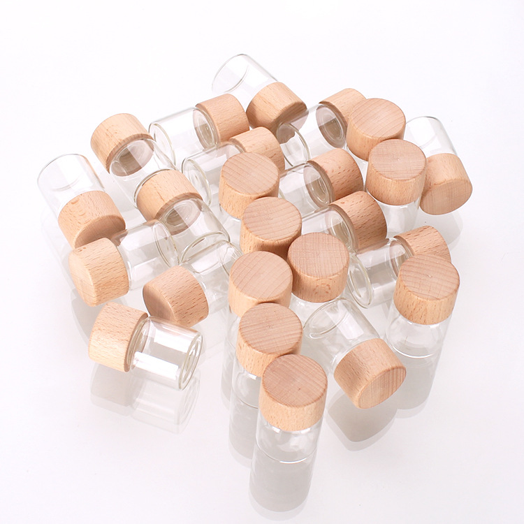 Tuobang Longchuan Glass 32mm diameter threaded sealed bottle, solid wood cap packaging material, 15ml wooden cap bottle, transparent small bottle, small golden bean storage bottle details Picture