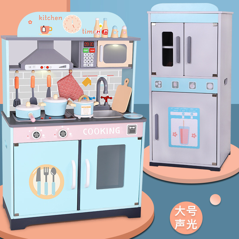 Children's simulated wooden blue kitchen toys. 3-year-old girl plays house in kindergarten with wooden kitchenware and stove scene Specification image