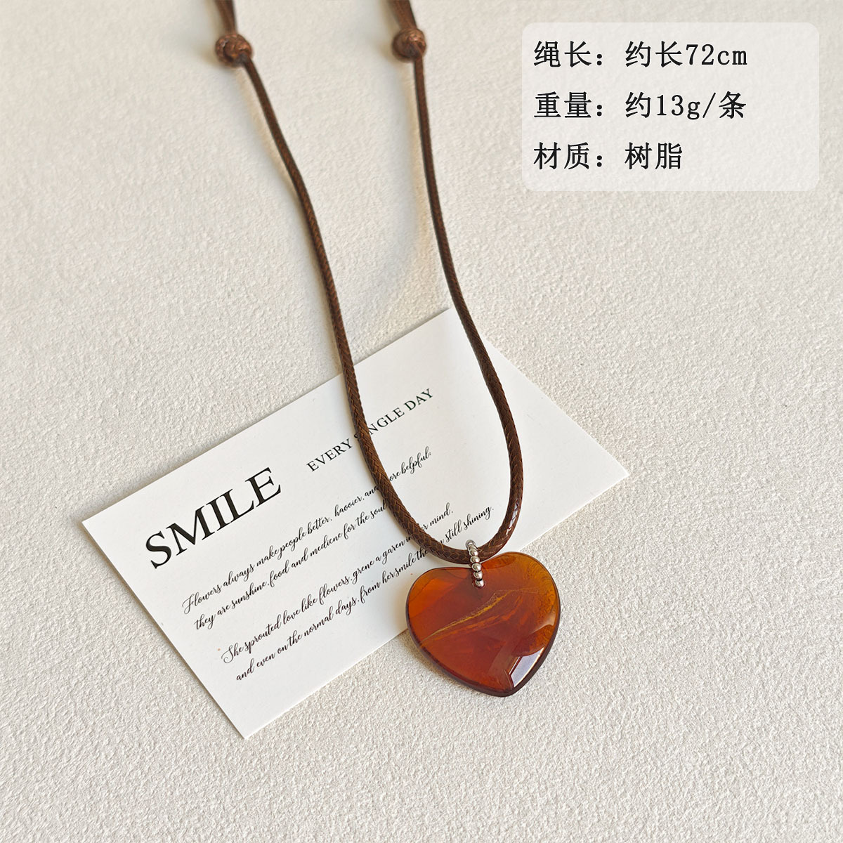 Retro rock sugar amber heart-shaped pendant necklace for women, adjustable wax rope, long sweater chain for autumn and winter, a niche accessory details Picture