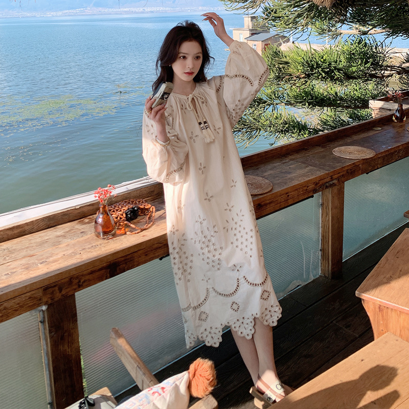 Real photo of a retro, gentle, cut-out embroidered V-neck apricot-colored dress, 2025 new seaside vacation style long-sleeved umbrella dress