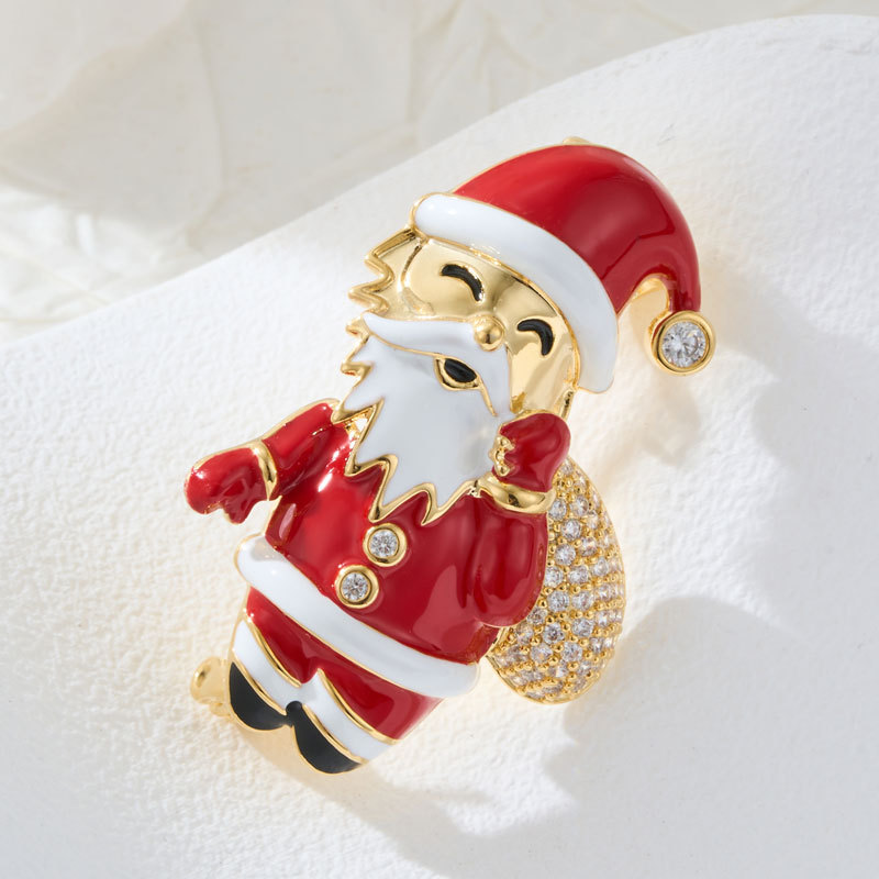 A great choice for Christmas gifts: a three-dimensional Santa Claus brooch made of copper alloy, with real gold electroplated enamel and zirconia inlaid