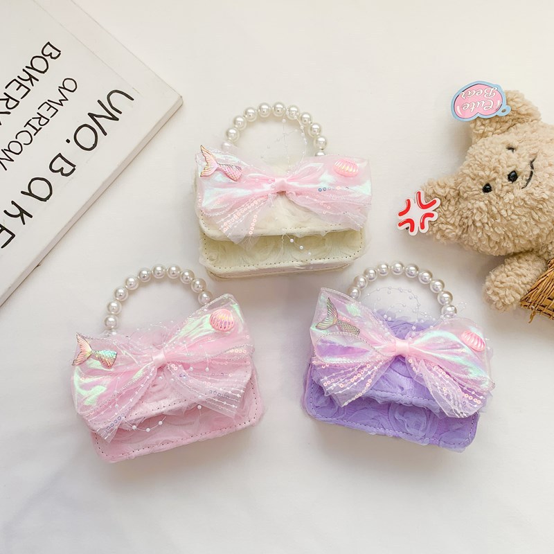 Pink, purple and beige pearl handle mini bag with bow decoration, fashionable and small handbag, trendy and versatile for women