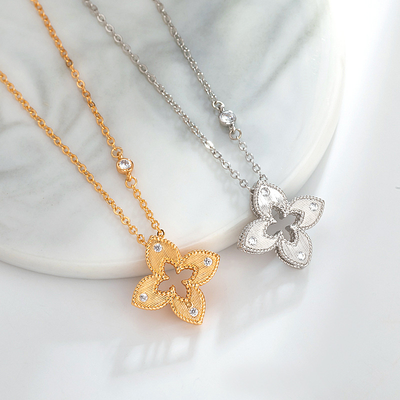The Bai Ling hollowed-out four-leaf flower brushed necklace exudes a sense of high-end women's style with a touch of light luxury. It is a golden Chinese-style pendant and accessory