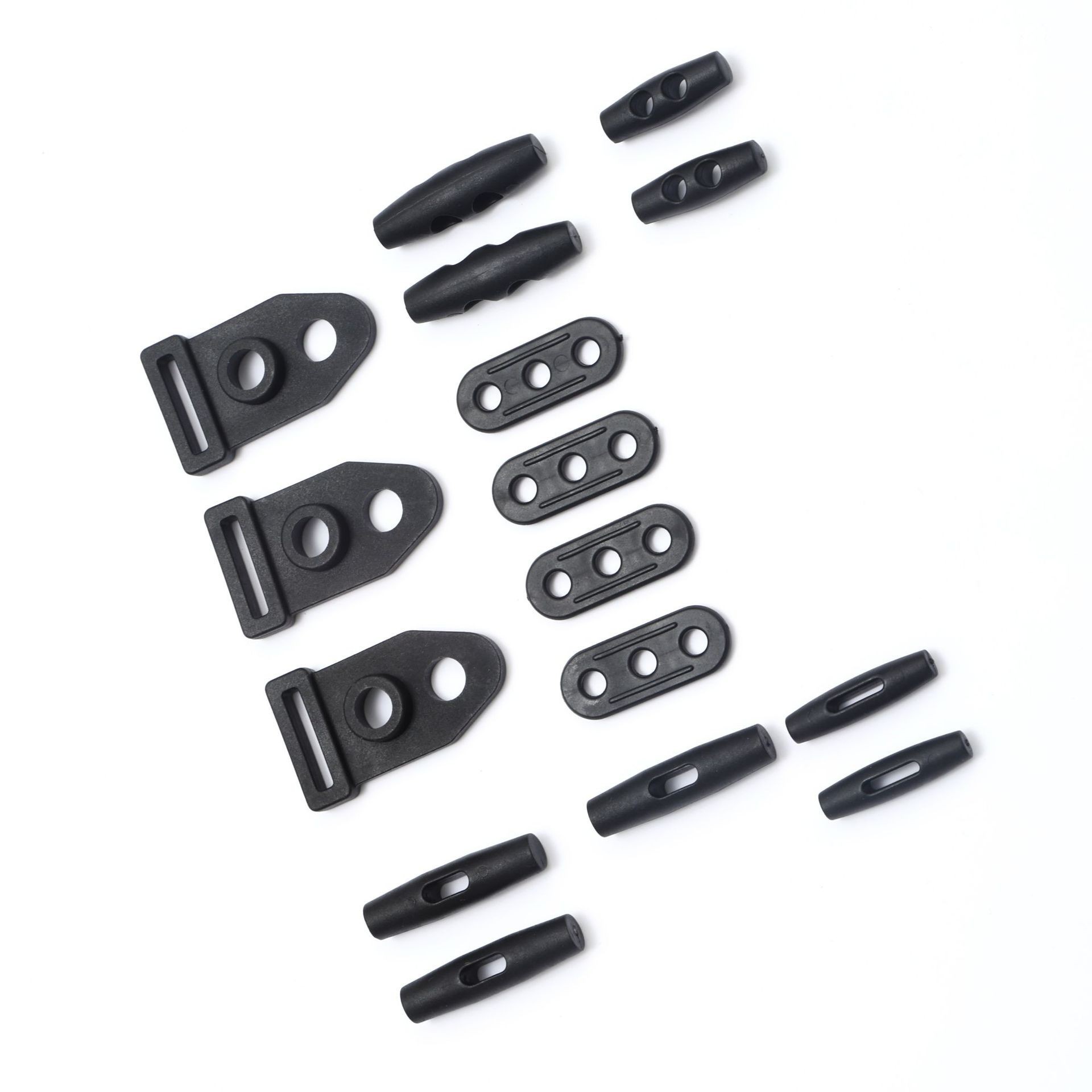 厂家供应优质箱包配件塑料绳扣单双孔橄榄扣 三孔片白底实物图