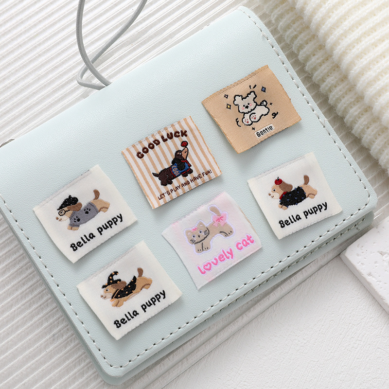 Cartoon Dachshund woven labels, cute cat and bear pattern baby clothes, decorated with hand-stitched clothes and hats details Picture