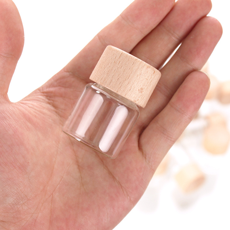 Tuobang Longchuan Glass 32mm diameter threaded sealed bottle, solid wood cap packaging material, 15ml wooden cap bottle, transparent small bottle, small golden bean storage bottle Item Picture