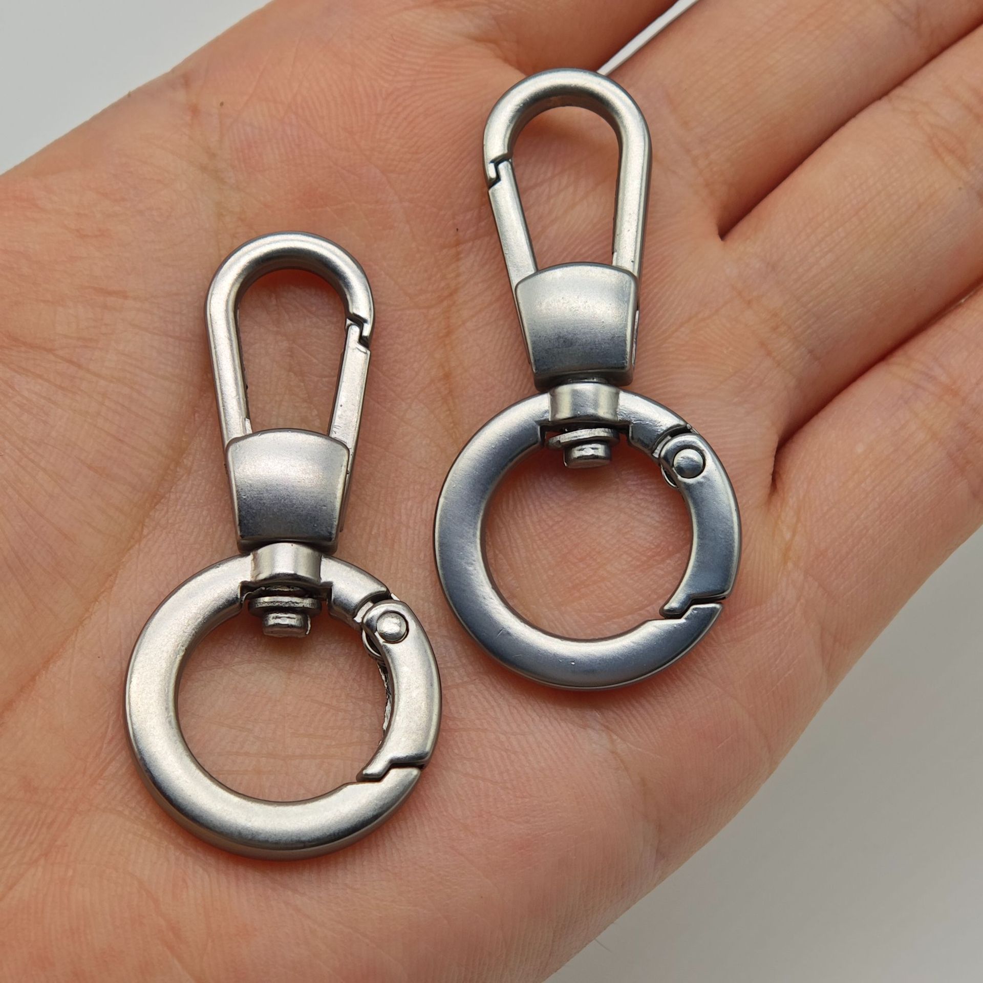 A 4-inch flat wire spring coil with matte silver plating, one-piece dog hook and mobile phone lanyard accessory, a diy board hook Application Scenario