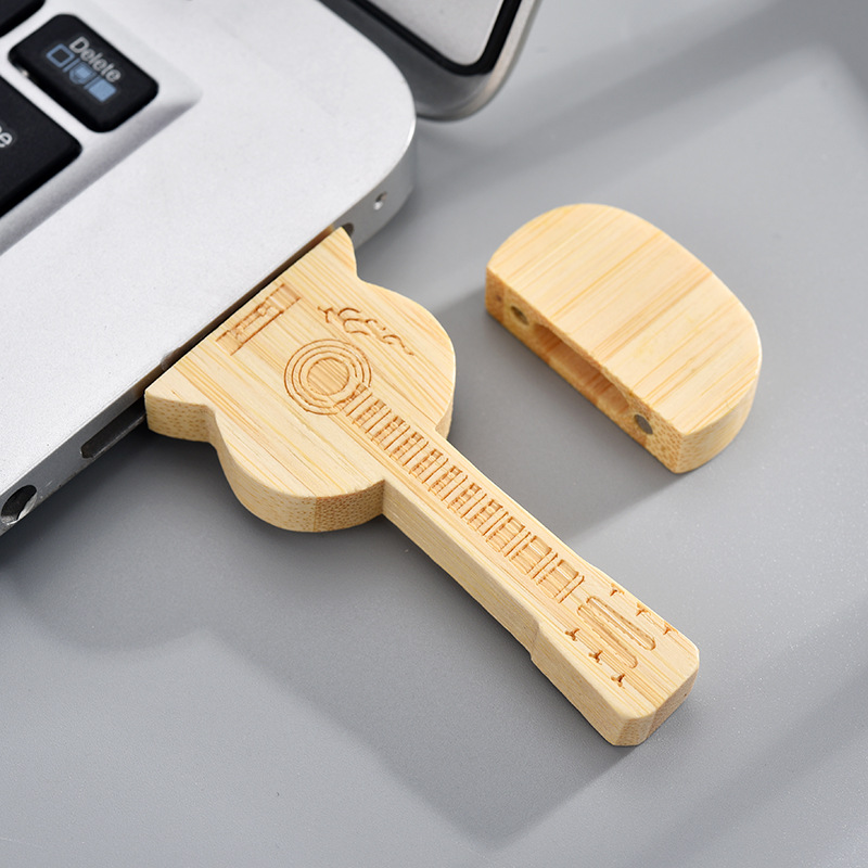 Wholesale wooden USB flash drives of 32g high-speed personalized guitars, corporate gifts, advertisements, 64g car USB flash drives in stock details Picture