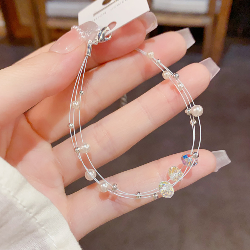 Amazon cross border fashion simple cristal perla de tres capas de línea de pesca pulsera temperamento ligero lujo diseño versátil sentido de la mano decoración details Picture