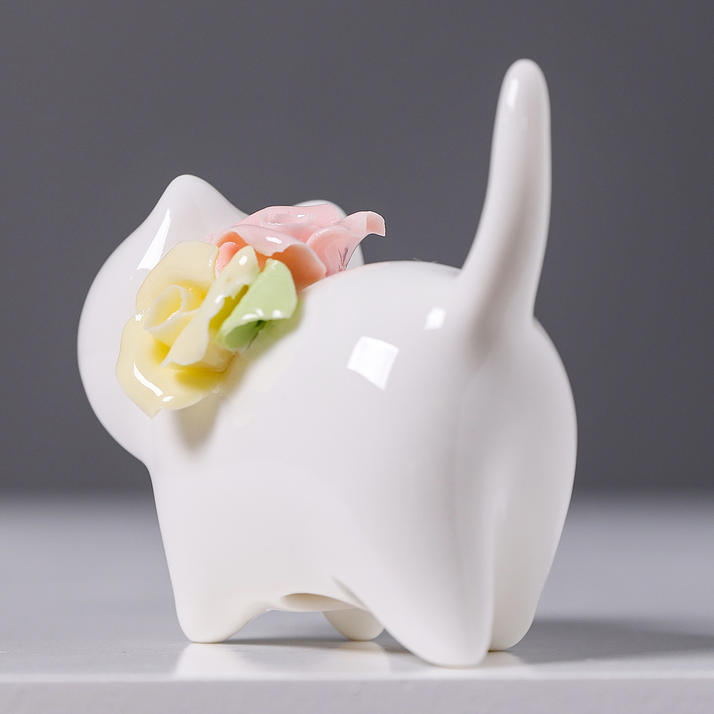 2026, a creative home tabletop decoration ceramic flower arrangement featuring hand-molded miniature cats in a jade-like white color Application Scenario