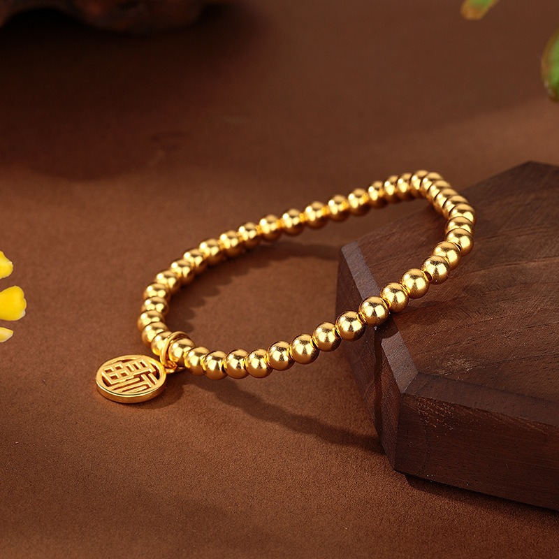 Wholesale jewelry copper gold-plated prayer and blessing pendant bracelets from the manufacturer, bringing continuous good luck and lasting color. Sand gold best-selling bracelets details Picture