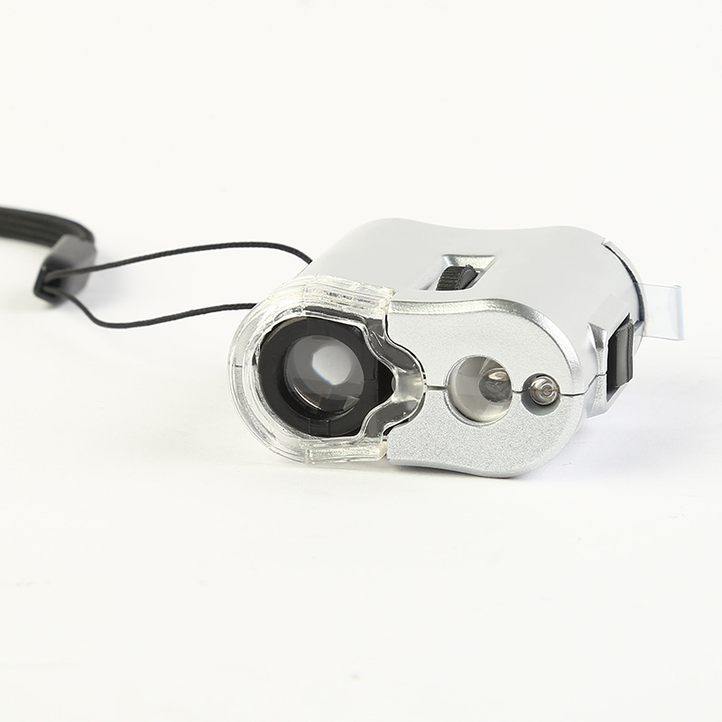 The new 9592 microscope, with a 60x magnifying glass and a lamp, is a multi-functional magnifying glass specifically designed for banknote and jewelry inspection. Factory direct sale Application Scenario