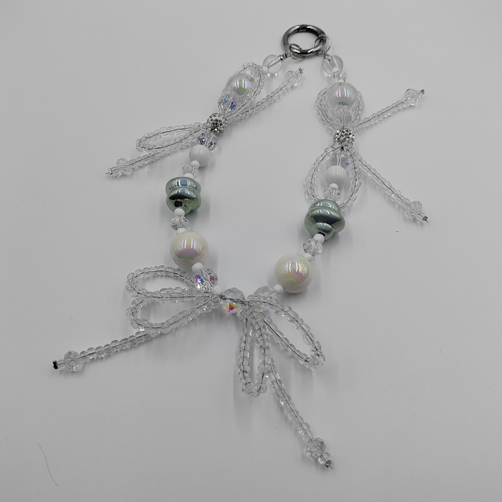 Factory direct supply of candy-colored hand-painted bracelets, new diamond balls, beaded keychains, car hangers, bows, and mobile phone pendants Application Scenario