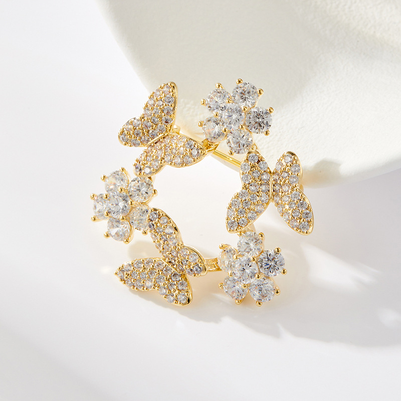 A light luxury style with a high-end butterfly wreath brooch, made of copper alloy and slightly inlaid with zirconium, is a fashionable and versatile clothing accessory and a best-selling women's pin Application Scenario