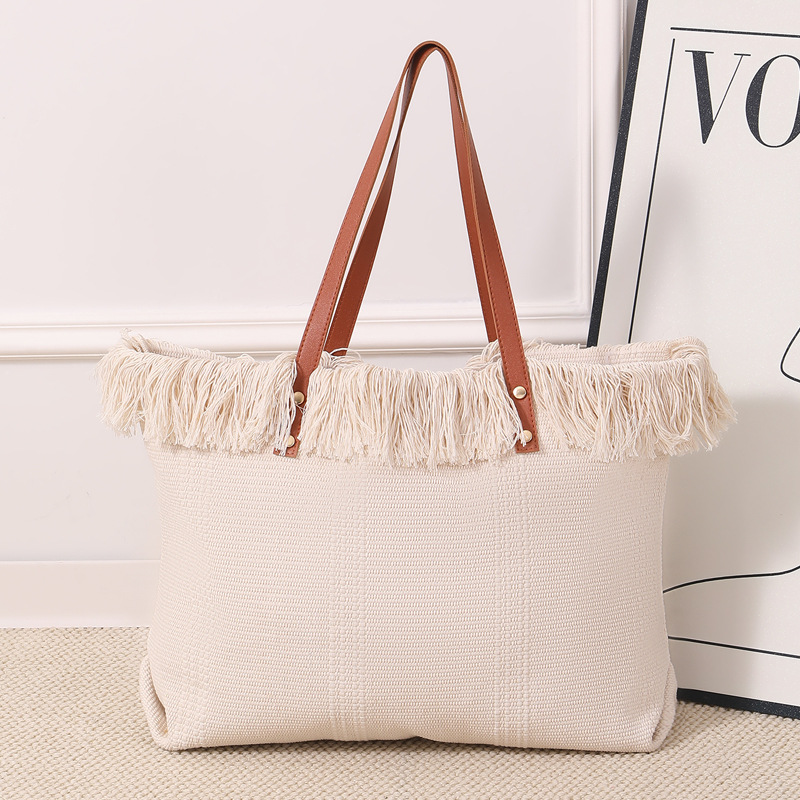 Cross-border canvas bag, fringed handbag, large-capacity portable and simple fringed tote bag, large-capacity simple hand-held shoulder canvas bag, commuting woven beach bag, women's canvas bag details Picture