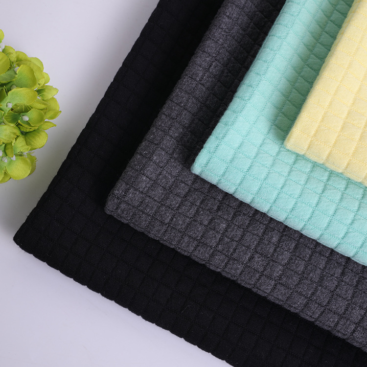 厂家供应针织提花面料 格子空气层涤纶tr布料全涤针织提花染色布