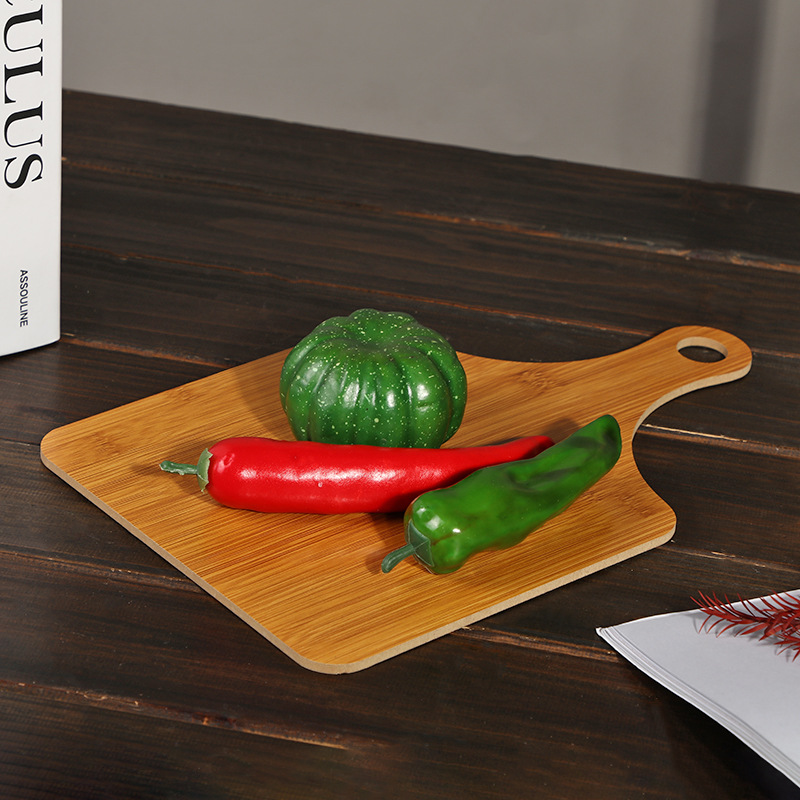 Wholesale of simple solid wood cutting boards for household use in the kitchen, featuring wooden bamboo grain with handles, fruit boards, cheese and pizza boards, and baking details Picture