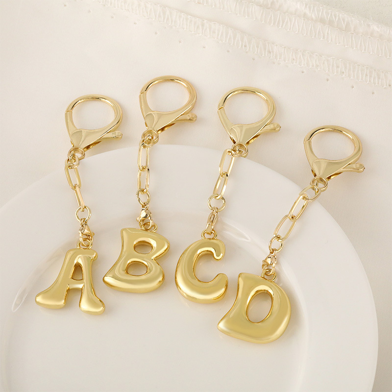 Cross-border bestseller 26-letter keychain pendant, 18K real gold electroplated, niche design, high-end charm details Picture