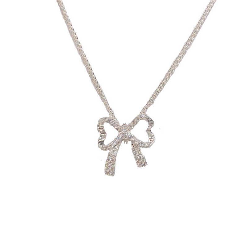 A niche, stylish, versatile, thick silver bow necklace with full diamonds, a women's light luxury and simple design sense collarbone chain wholesale Application Scenario
