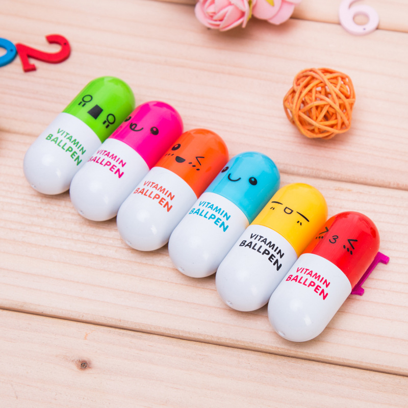 P-0128 Simple, new, cute cartoon smiling face telescopic capsule Ballpoint pen pill Pen stationery full figure
