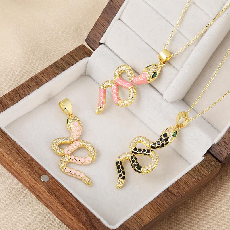 Wholesale and direct sales of new and popular micro-inlaid zircon oil-drip zodiac snake-shaped pendant accessories with cross-border personalized electroplated design Specification image