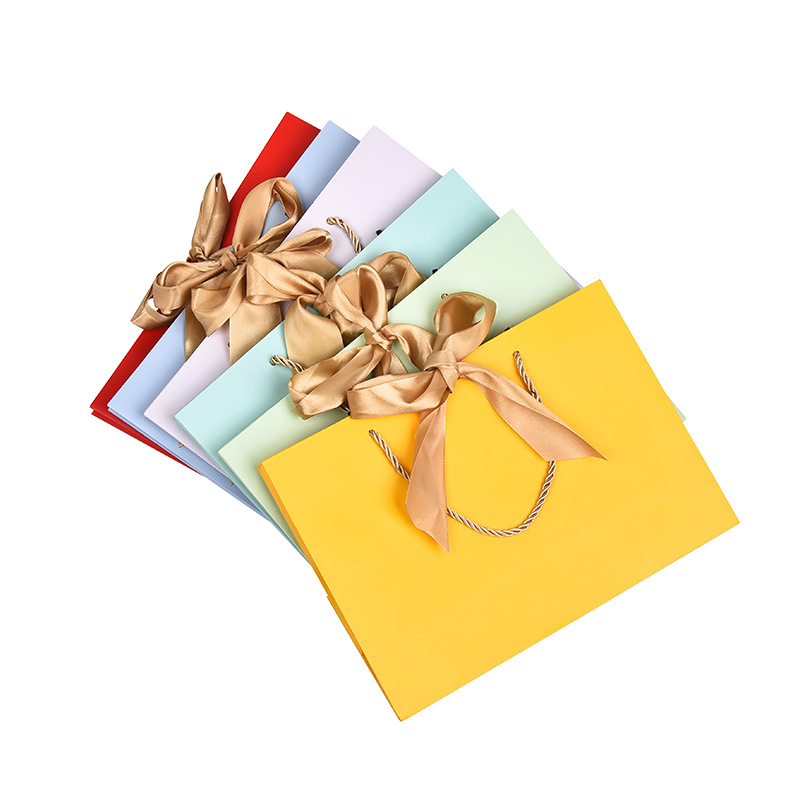 Wholesale of clothing handbags, paper bags, bow gift bags, shopping bags, solid-color packaging bags, logo printable gift bags, paper bags details Picture