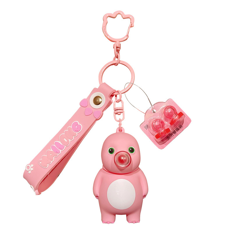 Genuine stress-relieving bubble-blowing pink milk dragon keychain, cute and creative female stress-relieving figurine key chain pendant Item Picture