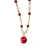 This autumn and winter new style of fashionable and retro beaded red pearl pendant necklace is unique, light luxury, gentle and versatile. It's a collarbone chain for women Item Picture