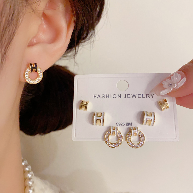 Wholesale of small and fashionable H-letter circular three-piece ear stud earrings with a feminine charm, simple and compact silver needle earrings details Picture