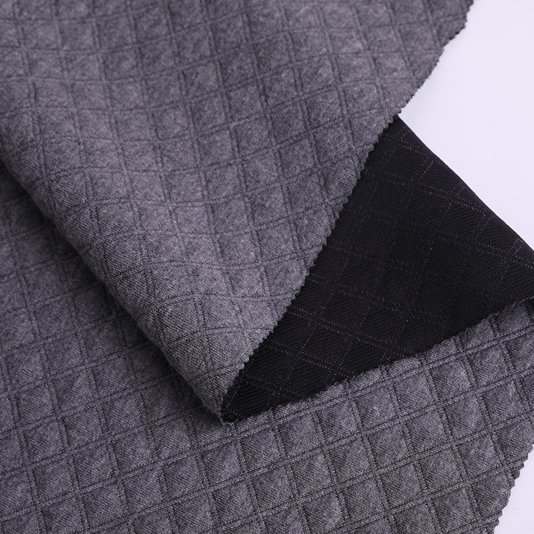 现货32s空气层提花面料菱形涤纶格子提花布保暖婴童爬爬服面料