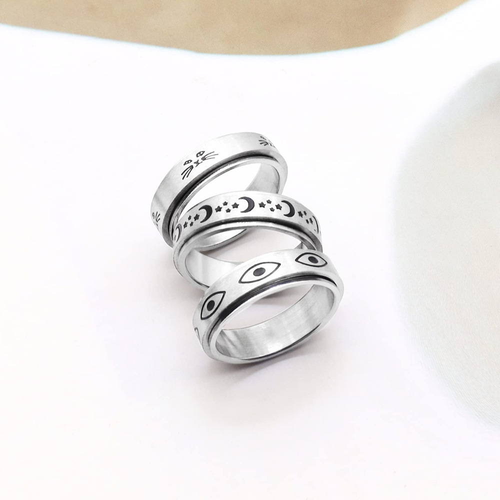 Amazon cross-border stainless steel pressure-reducing rotating star and Moon ring Titanium steel couple accessories Devil's Eye Ring details Picture