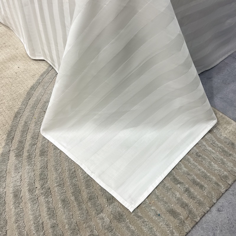 Light luxury satin hotel bedding, white ecological brushed four-piece set, hotel guest bed cover, bed sheet and bed hat style details Picture