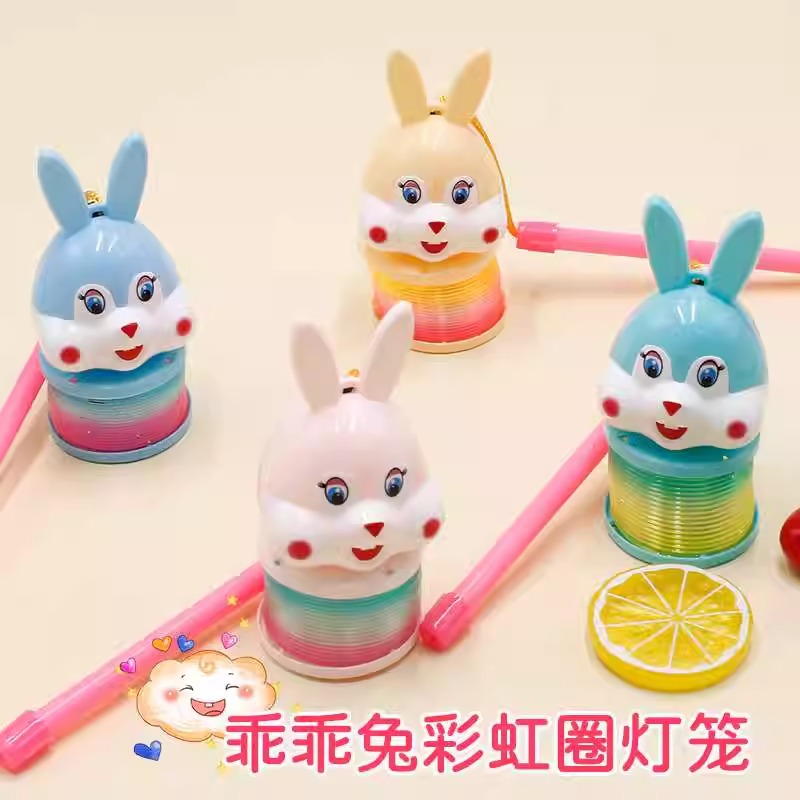 The 2023 Year of the Rabbit hand-held lantern rainbow ring cartoon rabbit luminous elastic rainbow ring spring ring toy is selling well details Picture