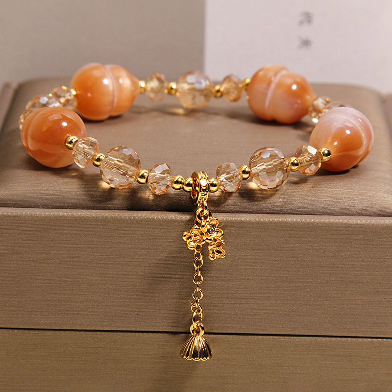 Nuevo estilo chino luz se convierte en rosa de melocotón calabaza pulsera de cristal para mujeres luz de lujo nicho alto sentido exquisito y versátil BFF mano cadena Application Scenario