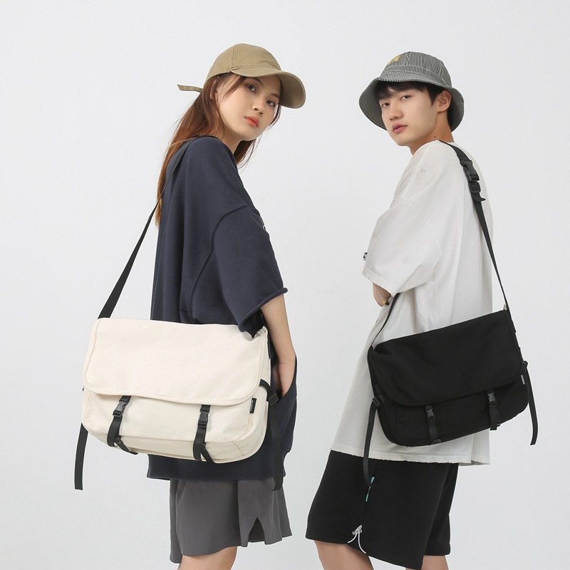 斜挎包男潮牌ins日系简约大容量单肩包学院风邮差包尼龙书包女生邮差包女包男包外贸包包