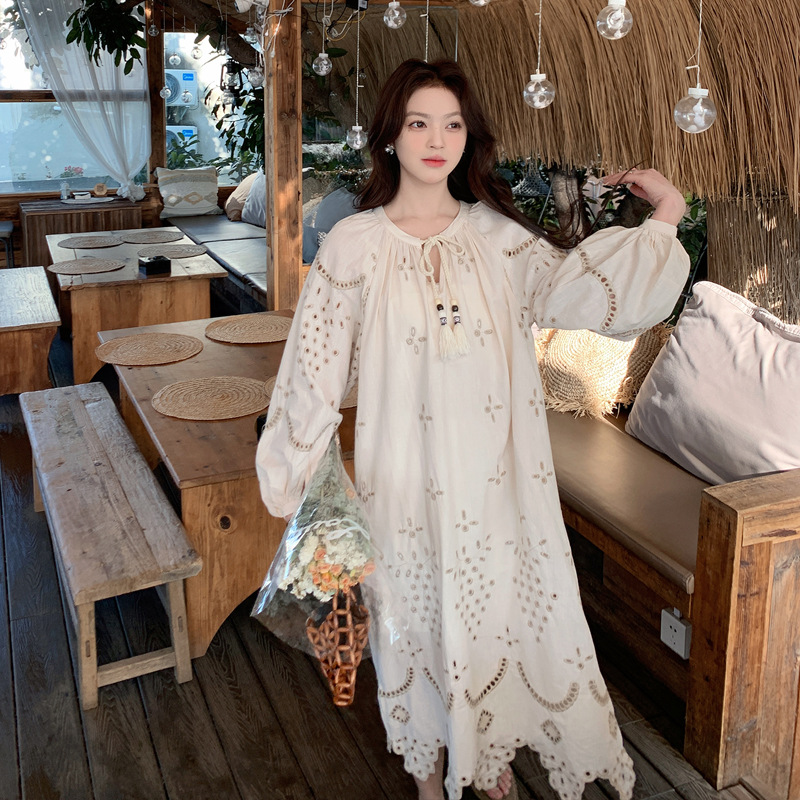 Real photo of a retro, gentle, cut-out embroidered V-neck apricot-colored dress, 2025 new seaside vacation style long-sleeved umbrella dress Specification image
