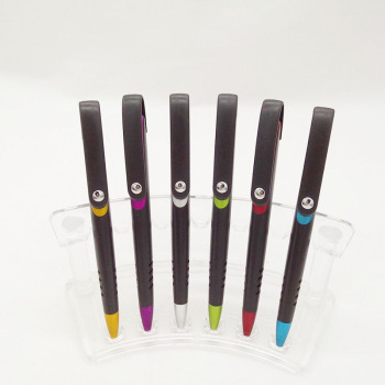 Close-up of textured pen surface showing sandblasted finish and colored clip