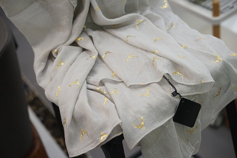 Cute gray antler pattern cartoon scarf on child in snow