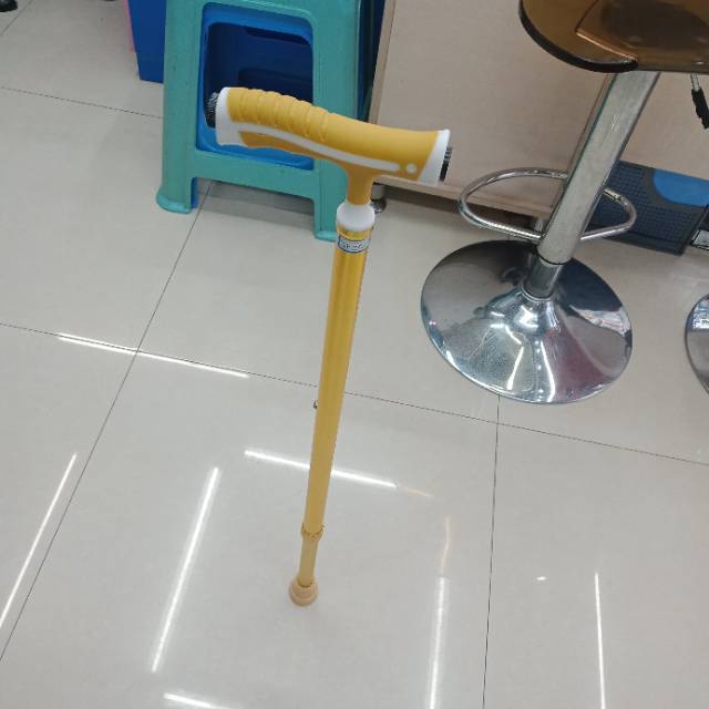 Yellow crutches stick to the ground with one hand to prevent slip thumbnail