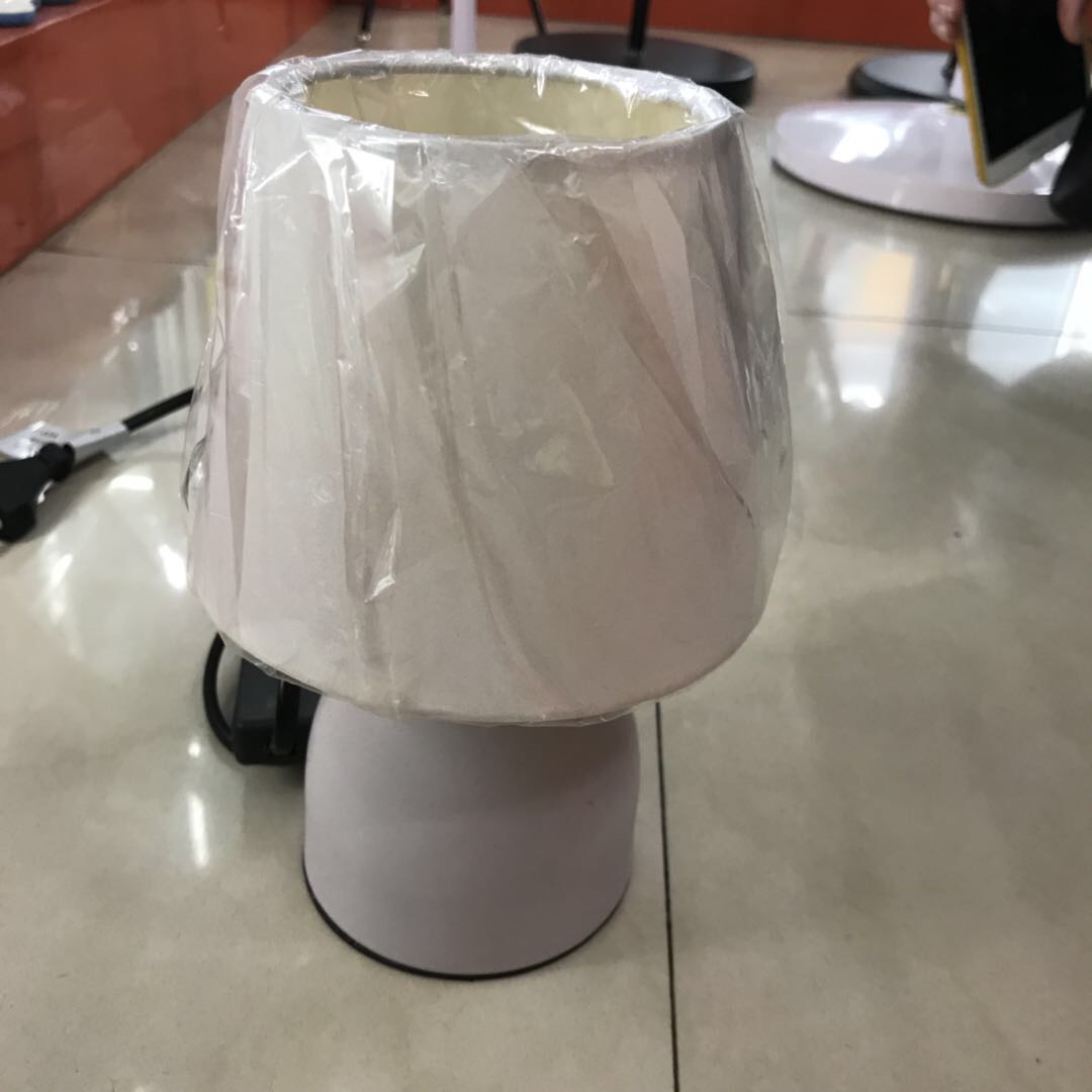 The cute beige desk lamp is small and exquisite, suitable for home use